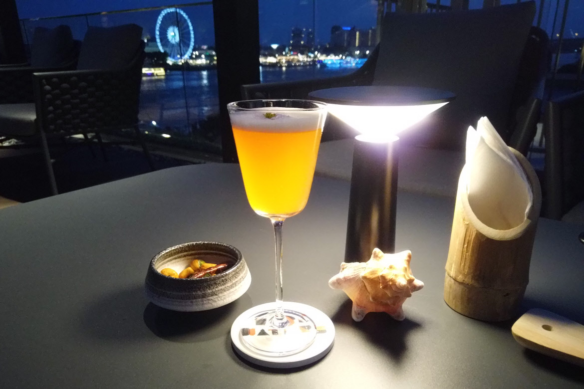 cocktail by Chao Phraya river in Bangkok